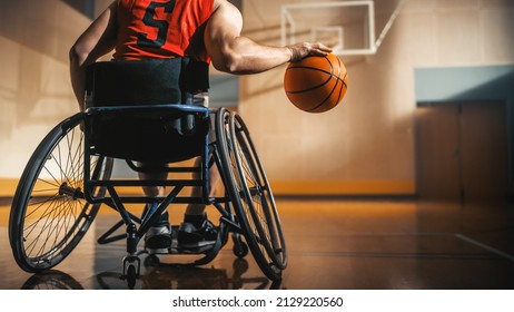 Wheelchair Basketball Player Wearing Red Shirt Dribbling Ball Like a Professional. Determination, Motivation of a Person with Disability Excelling at Team Sport. Anonymous, Back View Shot - Powered by Shutterstock