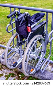 Wheelchair At A Bicycle Stand - Photo