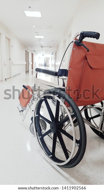Wheelchair for disabled patient at\
ward in the public hospital. medical care and insurance\
concept.