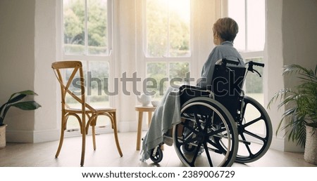 Similar – Senior woman in wheelchair alone in room