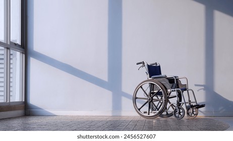 Wheelchair on Cobble Stone Tile Floor with Light and Shadow on Interior Wall Background in Medical Room at Hospital - Powered by Shutterstock