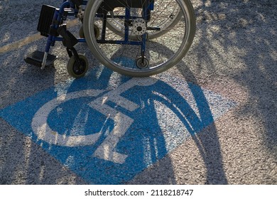 Wheelchair on disable parking reserved space lot,handicap respect