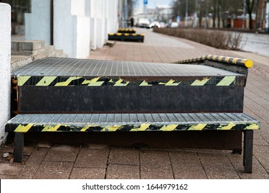 WHEELCHAIR RAMP With Grid,  Yellow Warning Lines On Sides. Shops, Offices And Service Providers. Street And Building Facade