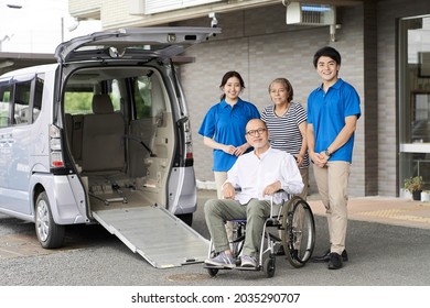 Wheelchair riding elderly and caregivers - Powered by Shutterstock