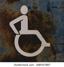 Wheelchair Rusty Sign Showing Our Neglect With Those Wheelchairs
