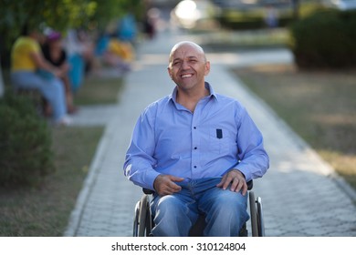 Wheelchair User Happy In The Park