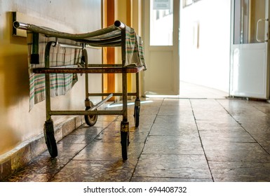 Wheelchair Wait For Visitors And Ill People In Corridor Of City Hospital. Wheelchair As Symbol Of Last Way. Social Hospital For Poor Man. Interior Of Old City Municipal Hospital.