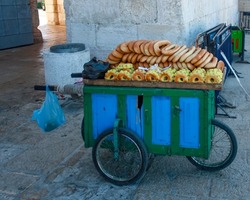 A Wheeled Colorful Street Vendor Cart With Sweet Bread, Buns And Spices For Sale In Old City, Jerusalem, Israel