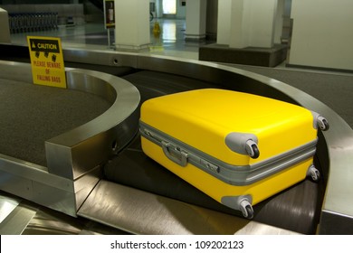 Wheeled Luggage On Airport Conveyor Belt