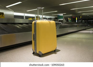 Wheeled Suitcase In Airport Terminal Baggage Claim Area