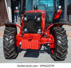 Wheeled tractor. Designed for various general agricultural operations, harvesting, soil cultivation, transport operations. Front view. - Shutterstock ID 1994125739