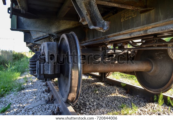 Wheels of a\
freight railway car close-up.\
Russia