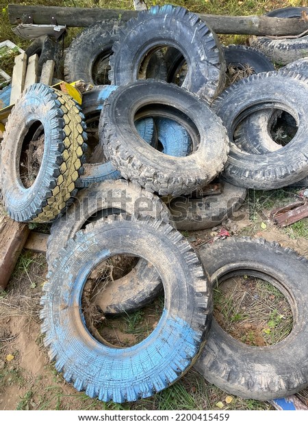 wheels from a large\
car lie on the ground