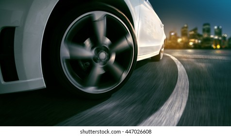 Wheels of a sports car at night