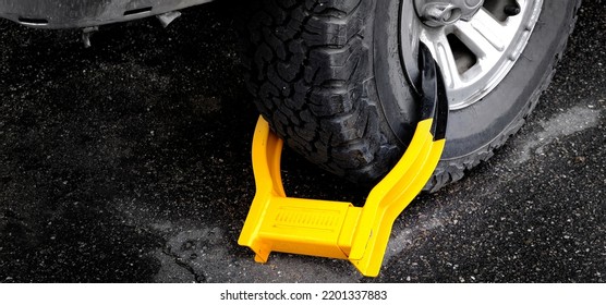 Wheet Boot Or Tire Lock On A Vehicle Or Car For Illegal Parking Violation 