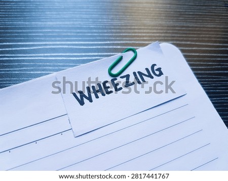 Wheezing writting on table  background. 