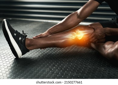 When in doubt, stretch it out. Studio shot of an unrecognizable man examining a knee injury during his workout. - Shutterstock ID 2150277661