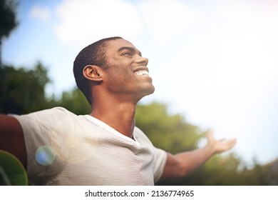 When Life Smiles At You, Smile Back. Shot Of A Man Standing Outside With His Arms Outstretched In Delight.