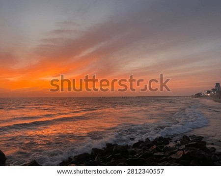 When the sky and the sea collapse into shades of dark red, the beach transitions from a place of tranquil beauty into a realm of Gothic intensity and mysterious power. This is a landscape where light is scarce, and the colors are deep, moody, and saturated with shadow.
The Dark Red Sky: A Somber Canopy
The sky is no longer a bright, fiery sunset; it has matured into a heavy, dramatic shroud of deep wine and bruised plum tones