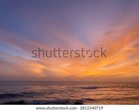 When the sky and the sea collapse into shades of dark red, the beach transitions from a place of tranquil beauty into a realm of Gothic intensity and mysterious power. This is a landscape where light is scarce, and the colors are deep, moody, and saturated with shadow.
The Dark Red Sky: A Somber Canopy
The sky is no longer a bright, fiery sunset; it has matured into a heavy, dramatic shroud of deep wine and bruised plum tones