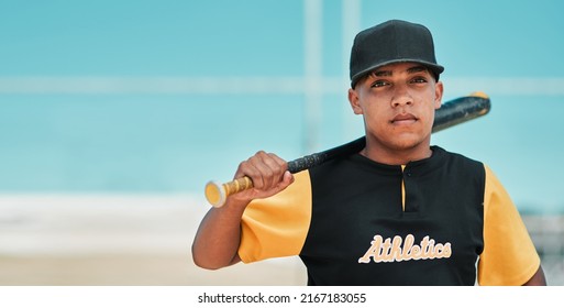 When I Swing, I Dont Miss. Shot Of A Young Baseball Player Holding A Baseball Bat While Posing Outside On The Pitch.