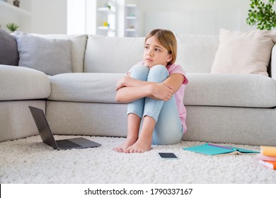 When We Go To School. Full Size Photo Of Frustrated Kid Girl Tired Study Remote Corona Covid Virus Quarantine Look Imagine Infection Stop Spreading Sit Floor Carpet In House Indoors