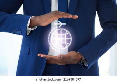 Wherever you go, weve got you covered. Shot of an unrecognisable businessmans hands covering a graphic of an airplane traveling around the world. - Shutterstock ID 2169384397