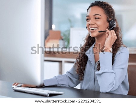 Whether you need help or advice, shes the agent for you. an attractive young female call centre agent working in her office.