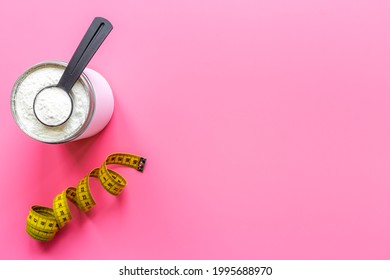 Whey Protein In A Jar With A Tape Measure. Sports Nutrition. Overhead View