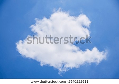 While Clouds free form shapes on blue sky background.
