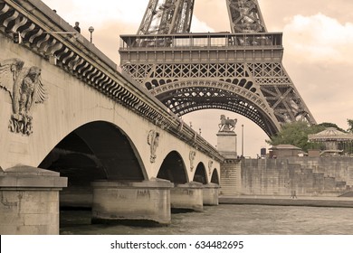 While French Elections Are Making Headlines, Eiffel Tower Remains Popular As Ever With Tourists, Paris France. Sepia Filter