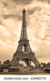 While French Elections Are Making Headlines, Eiffel Tower Remains Popular As Ever With Tourists, Paris France. Sepia Filter