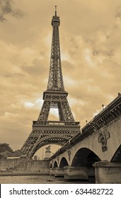 While French Elections Are Making Headlines, Eiffel Tower Remains Popular As Ever With Tourists, Paris France. Sepia Filter