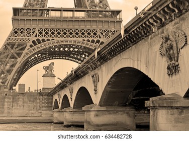 While French Elections Are Making Headlines, Eiffel Tower Remains Popular As Ever With Tourists, Paris France. Sepia Filter