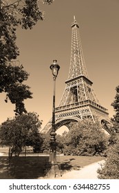 While French Elections Are Making Headlines, Eiffel Tower Remains Popular As Ever With Tourists, Paris France. Sepia Filter