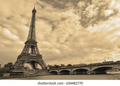 While French Elections Are Making Headlines, Eiffel Tower Remains Popular As Ever With Tourists, Paris France. Sepia Filter