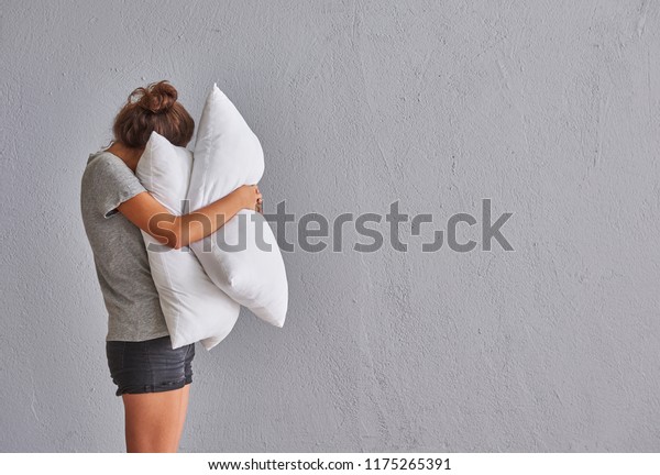 hugging pillow while sleeping