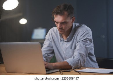 While others are sleeping.man works overtime at night - Shutterstock ID 2255609457