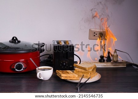 While toasting bread and using an electric pan, it causes a short circuit, a flame, a fire, and an old and poor quality plug. or using an overload of electricity