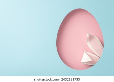 Whimsical Easter concept image. Top-view shot of endearing bunny ears protruding from a pink egg-like opening on a sky-blue background, space for personalized text