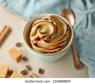whipped caramel and coffee mousse cream dessert on kitchen table