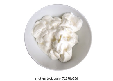 Whipped Cream In A Bowl Isolated On A White Background, Overhead View From Above. Selected Focus