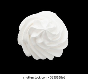 Whipped cream isolated on a black background with clipping path. Top view.