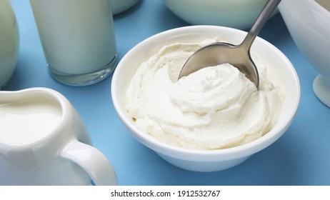 Whipped Cream With Spoon On Blue Background, Greek Yogurt, Top View