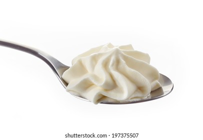 Whipped Cream In A Spoon On White Background