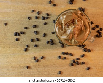 Whipped Dalgona Coffee Top Down View With Coffee Beans.