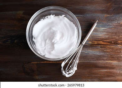 Whipped Egg Whites For Cream On Wooden Table, Top View