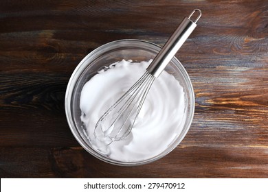 Whipped Egg Whites For Cream On Wooden Table, Top View