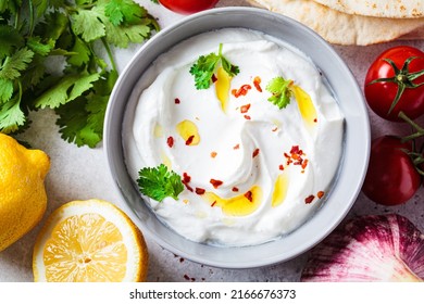 Whipped Feta Cheese Dip With Garlic And Lemon In A Gray Bowl, Top View. Greek Cuisine Concept.