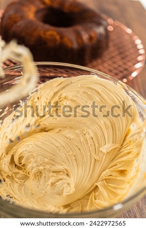 Whipping up salted caramel buttercream frosting for the gingerbread bundt cake.
